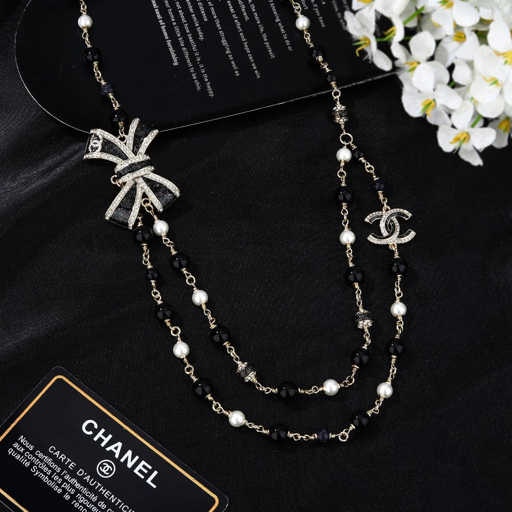 CHANEL 25S CHAIN BELT IN BLACK AND WHITE PEARL 614285