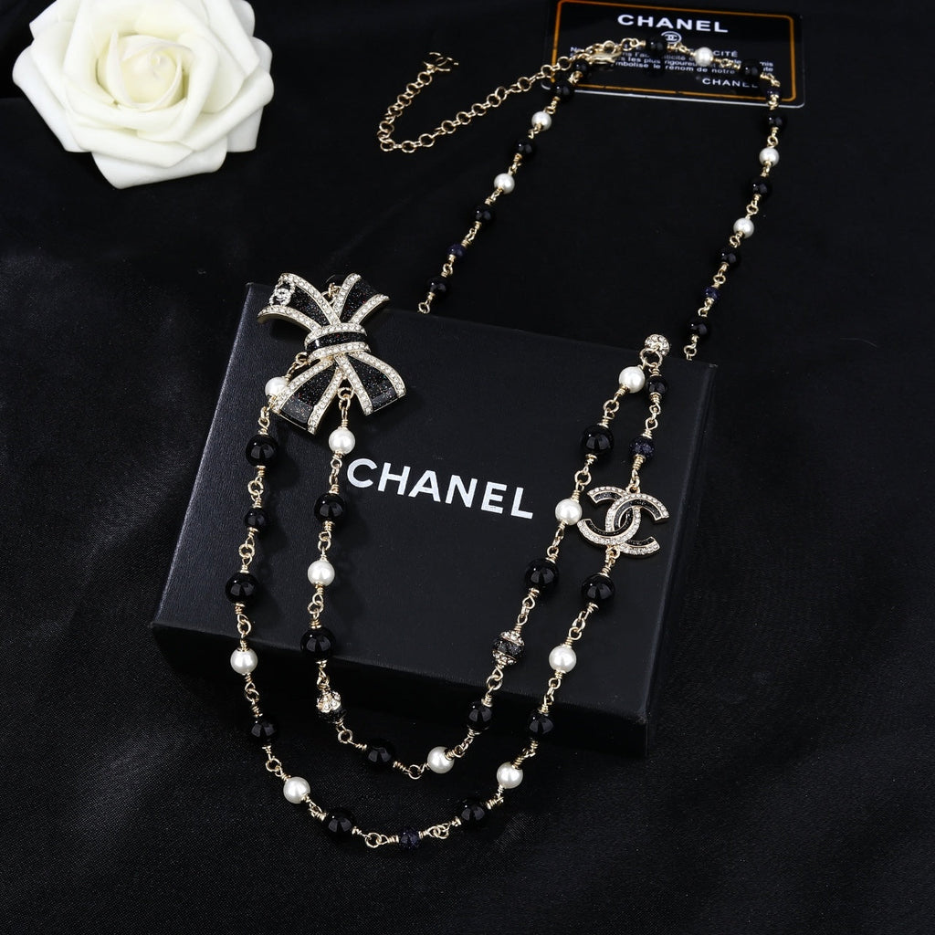 CHANEL 25S CHAIN BELT IN BLACK AND WHITE PEARL 614285